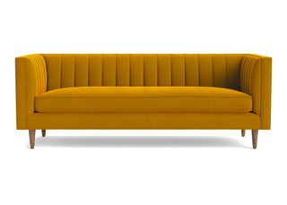 Shelter arm Belmont sofa with gold velvet and cone legs