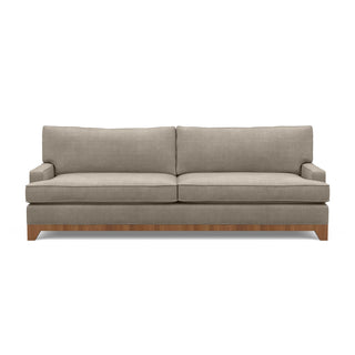 A modern, sophisticated sofa with an exposed wood base