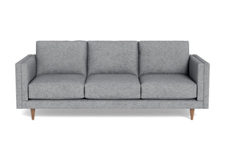 Hoyt sofa with track arms, padded bolster pillow, light grey tweed fabric and walnut cone legs