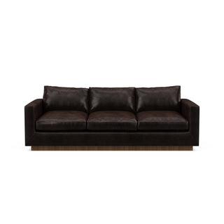 The Lowe Sofa in dark leather reflects minimalistic home design